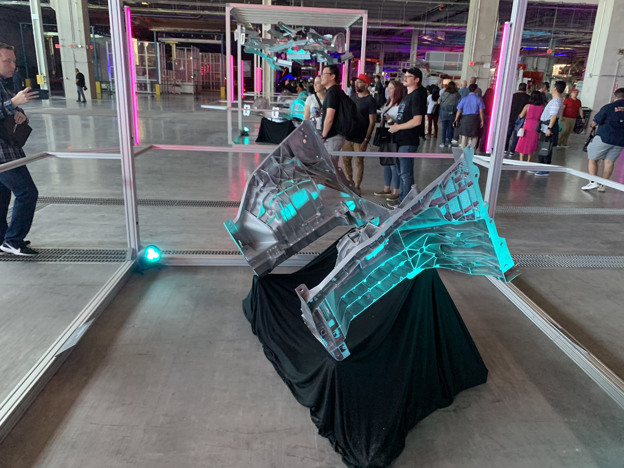 Tesla demonstrating the Mega Casting components on the Model Y at the event