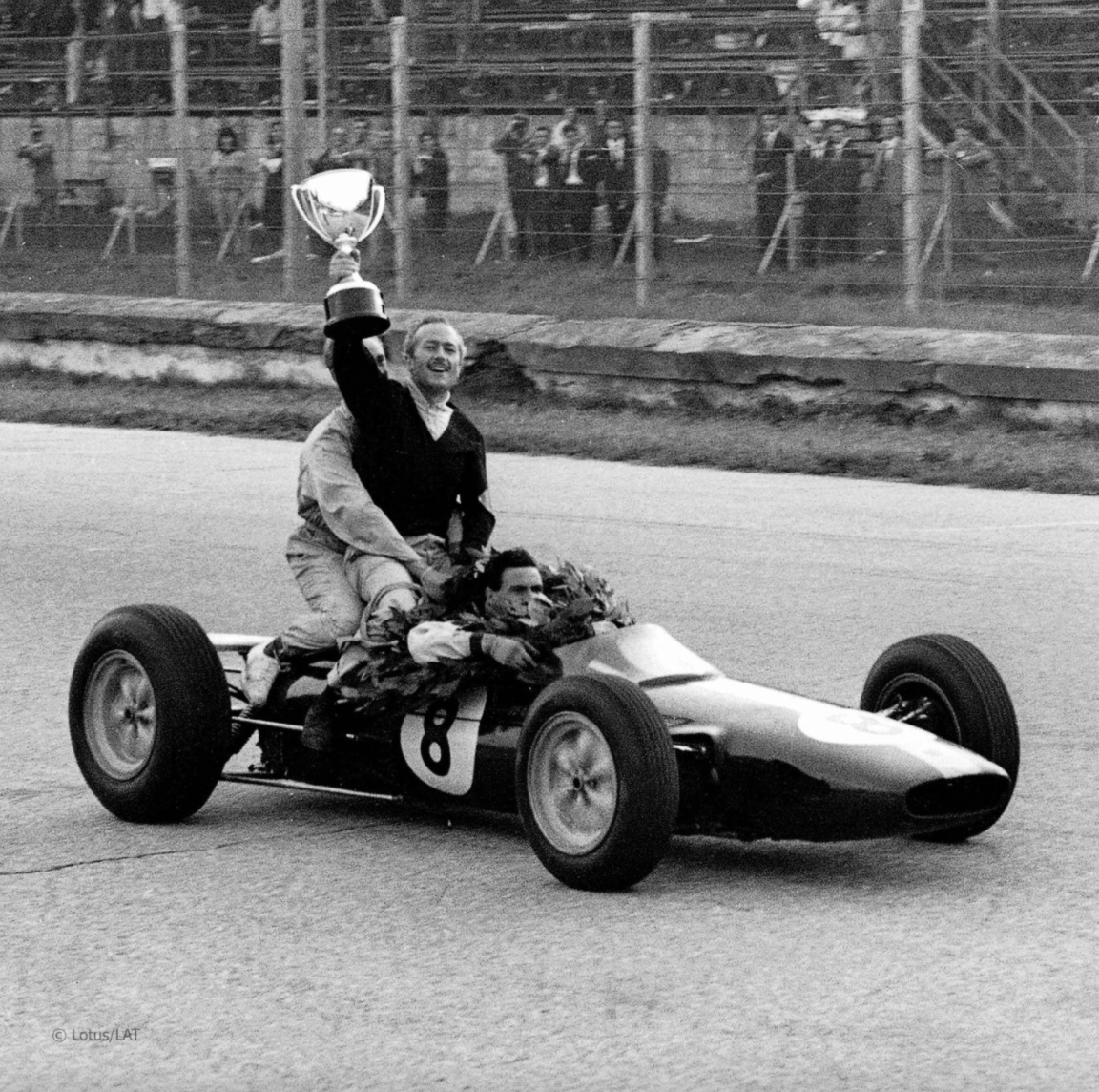 In 1963, Chapman and Jim Clark celebrated their Monza GP victory on the first-ever monocoque race car, the Lotus 25