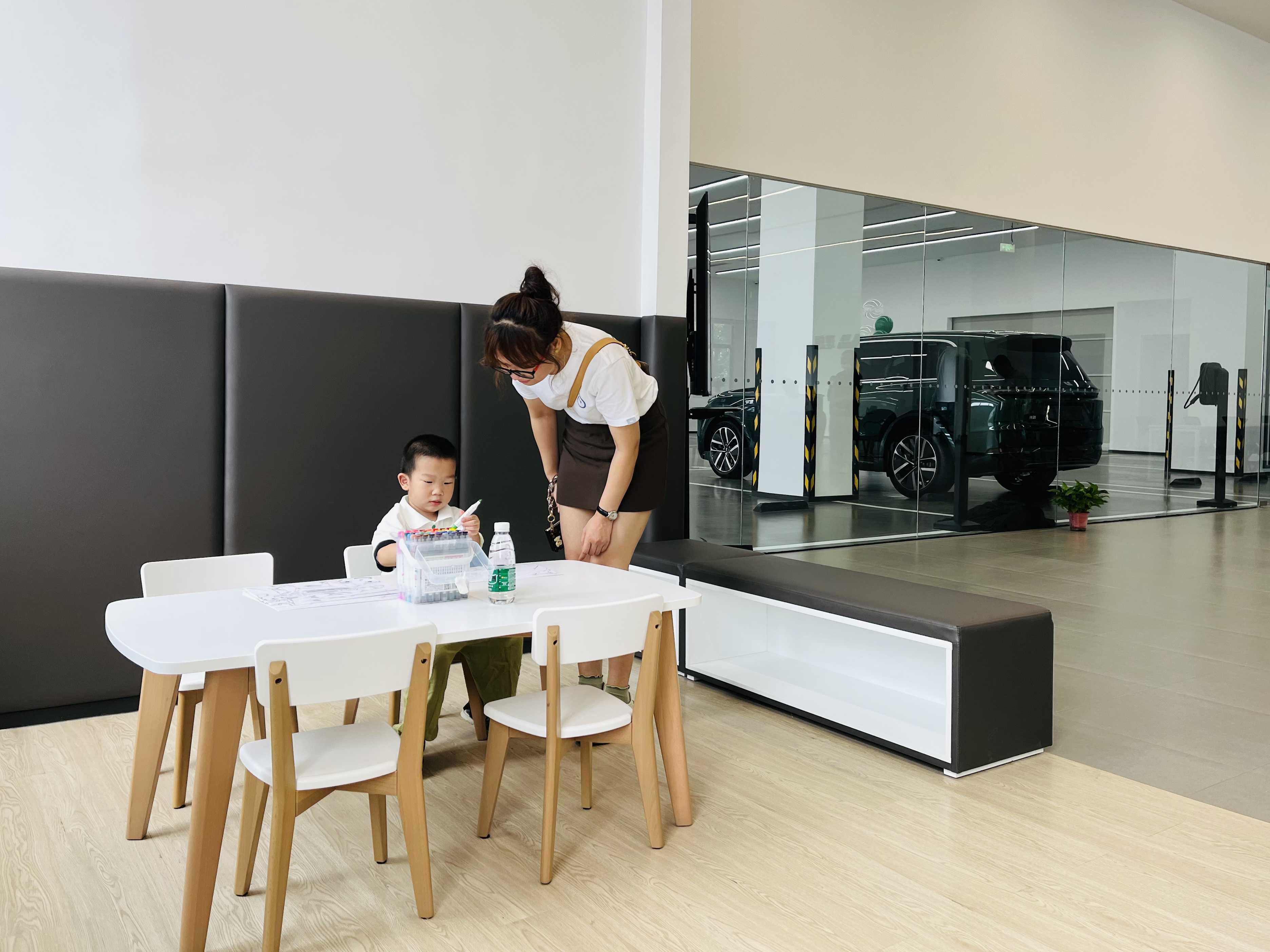 Madam and child waiting in the rest area