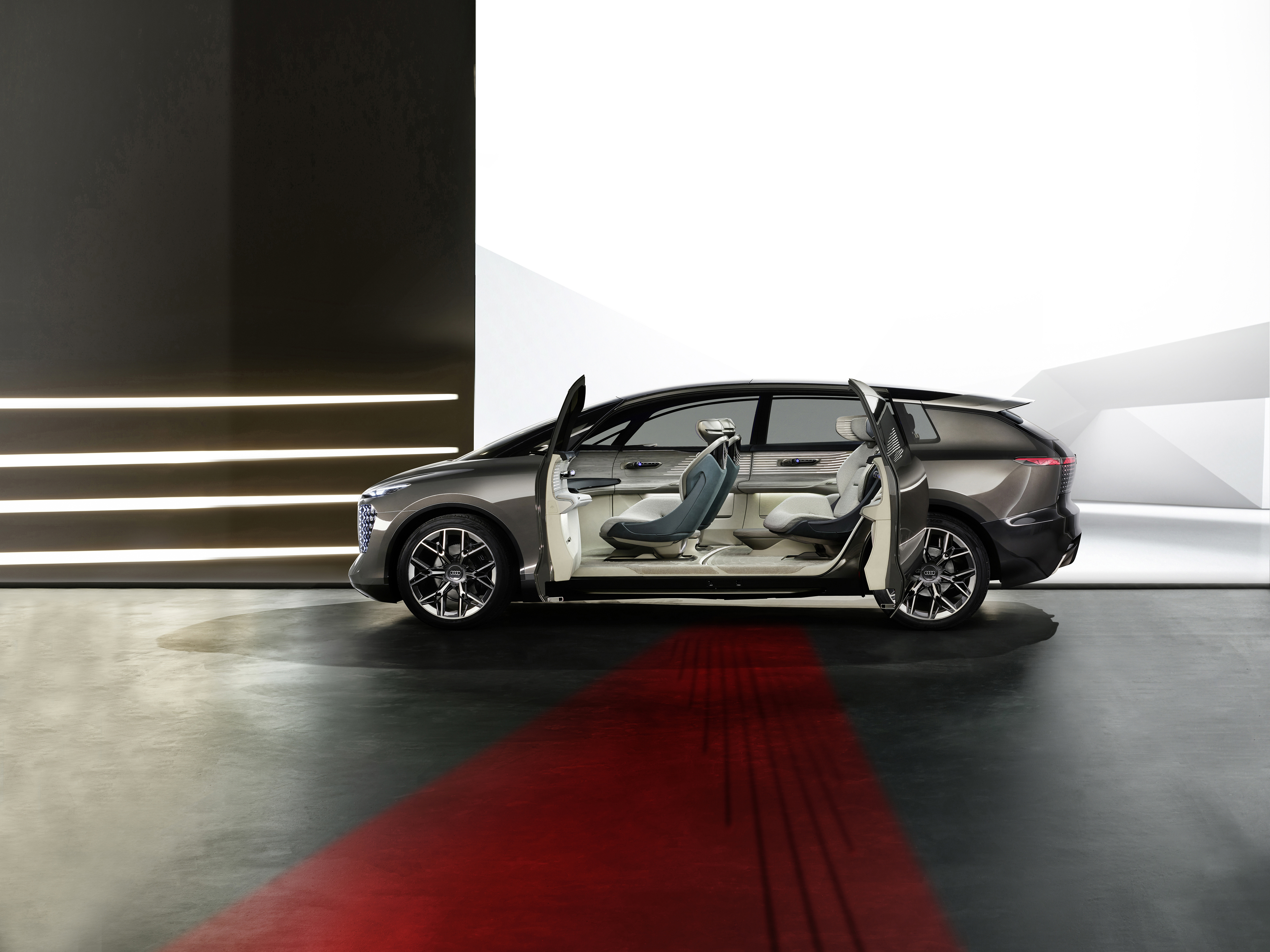 urbansphere with a "suicide door" design, with "red carpet" pattern projected by the vehicle