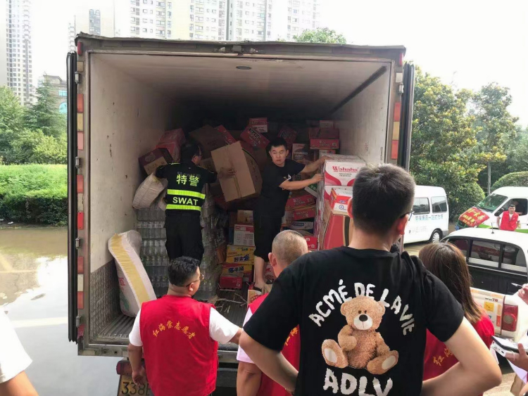 Volunteers transporting materials