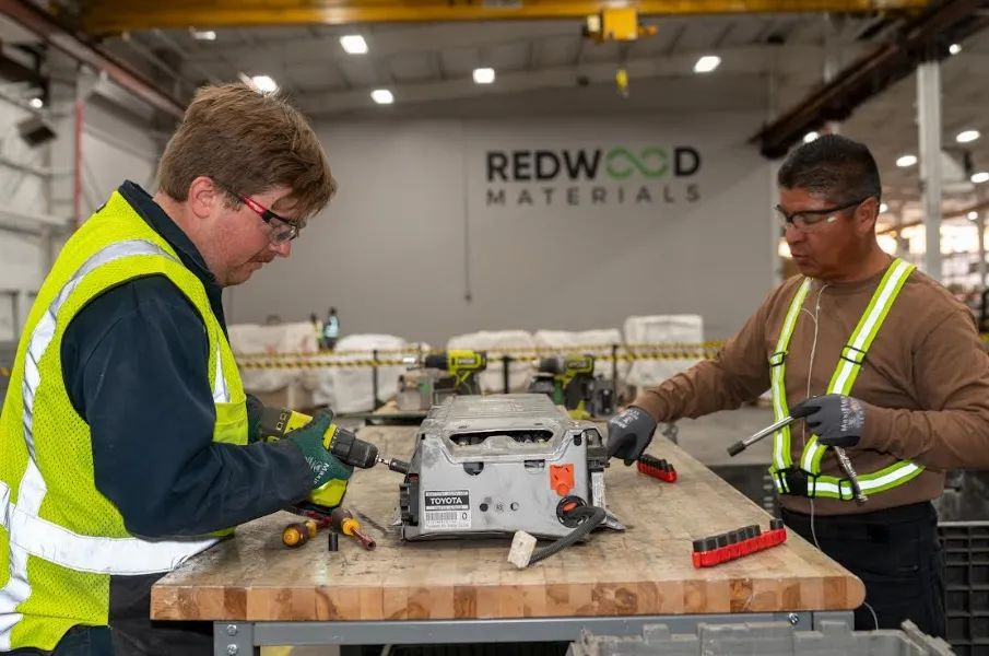 Workers from Redwood Materials are at work.