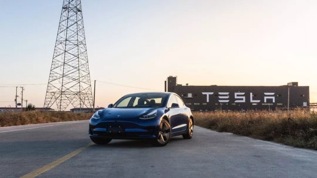 The Model 3 I am driving, together with the miraculous factory behind it.