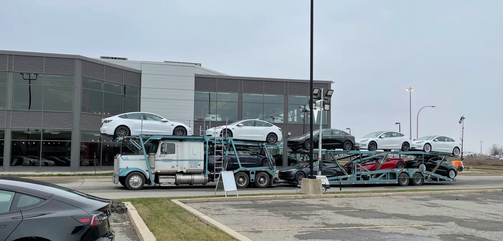 Tesla North America offers 1 year of free Supercharging, aiming to deliver 500,000 vehicles annually.