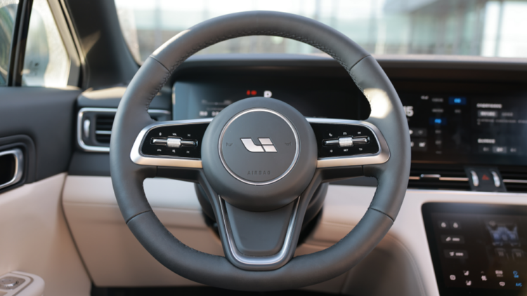 New steering wheel design with "hidden" interactive tricks.