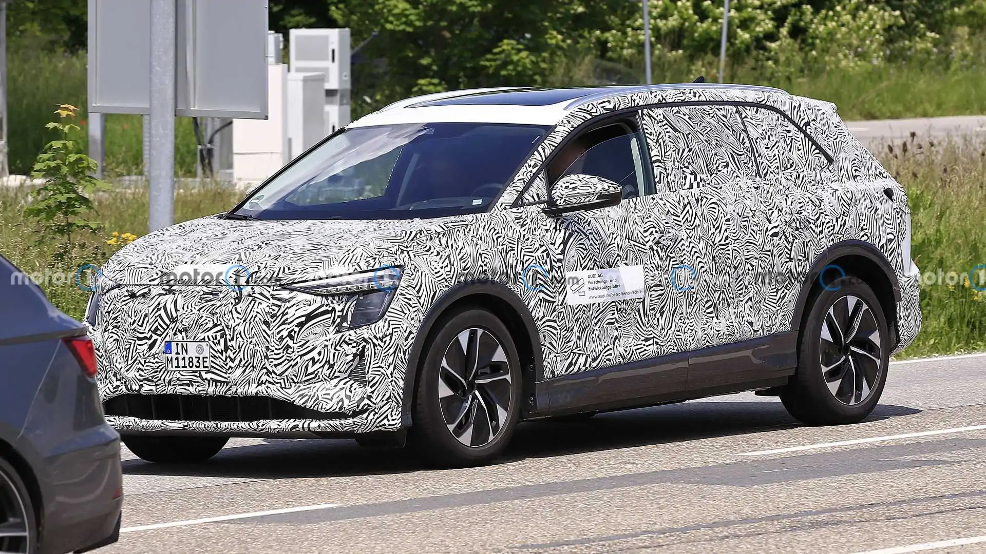 Audi's medium-sized electric SUV begins road testing in Germany.