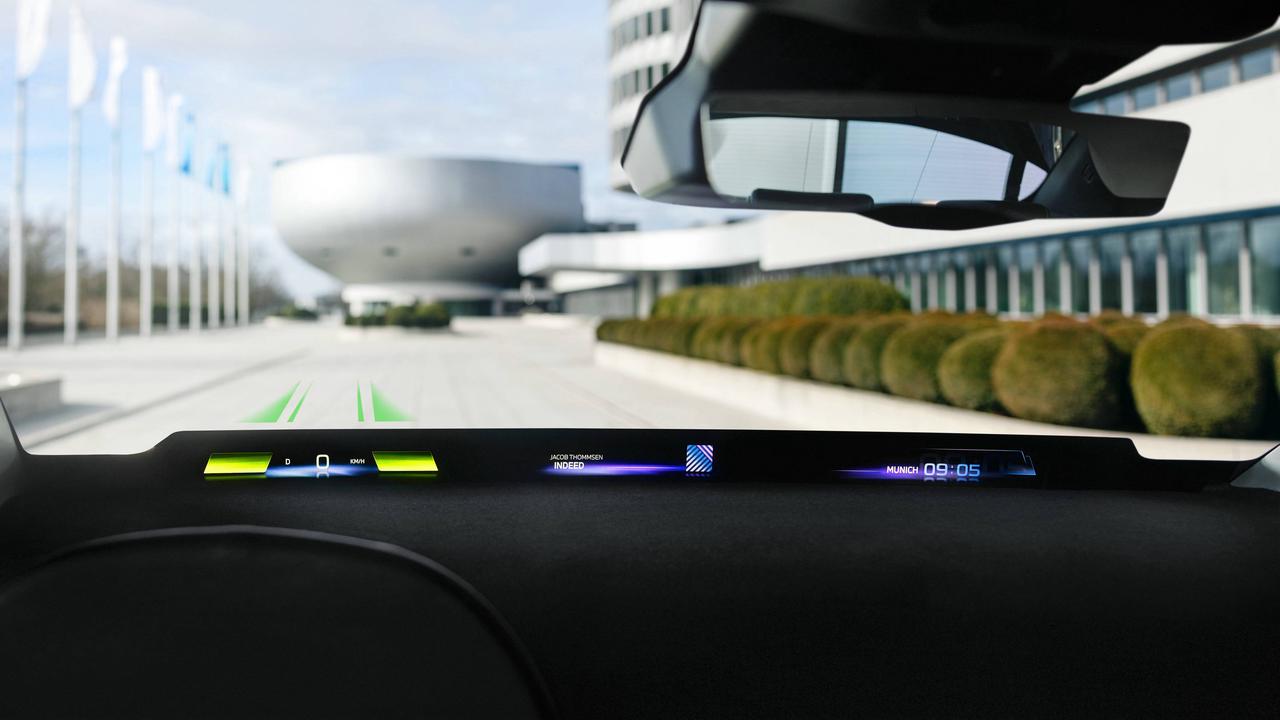 BMW Introduces Immersive Driving Experience with Panoramic Windshield Display at Shanghai Auto Show.