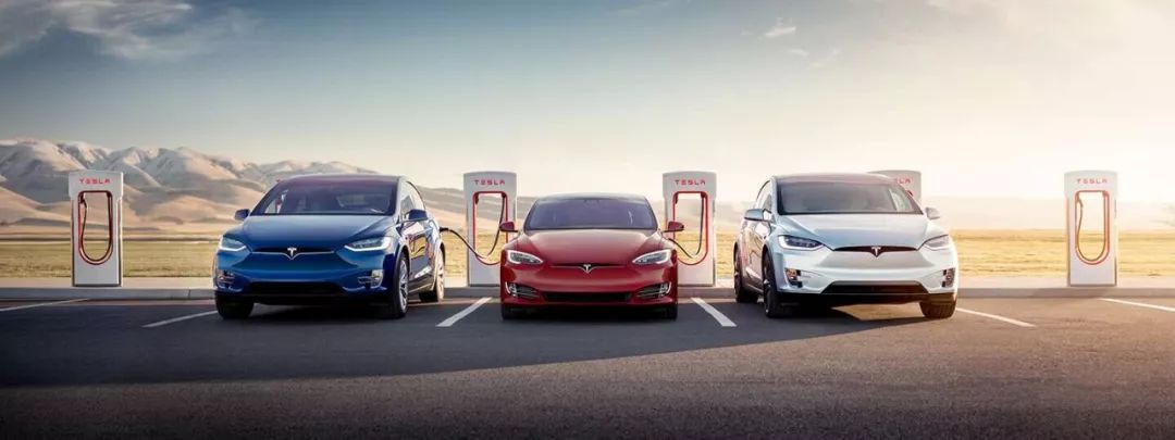 Tesla Supercharging station at night